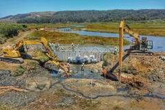 Replacing sandbag dam with organic water & sediment control structure.